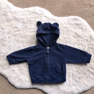Navy blue zip up jacket with a hood